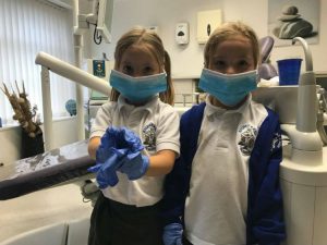 School children in dental surgery wearing dental masks
